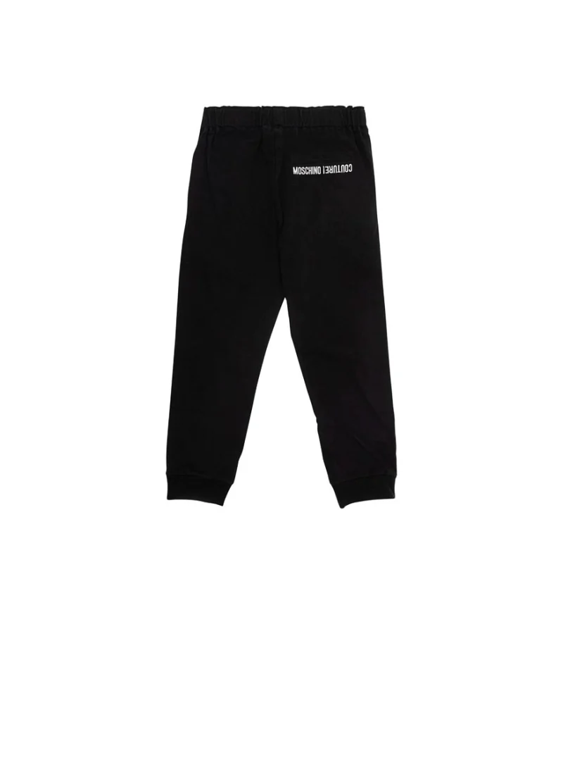 Памучен панталон с принт Moschino Kids — снимка 3