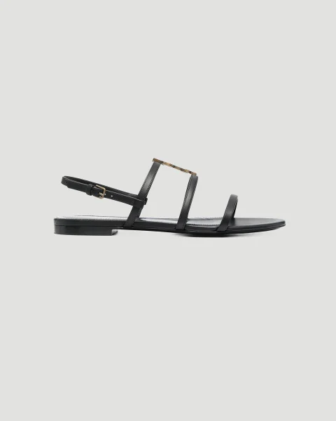 Cassandra Ankle-Strap Flat Sandals in Black Leather